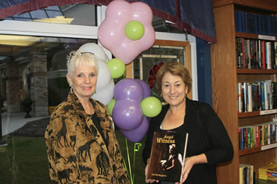 Gail presents her Angel Witness Book to Doris, Debono, Assistant Manager, The Village of Humber Heights, Etobicoke